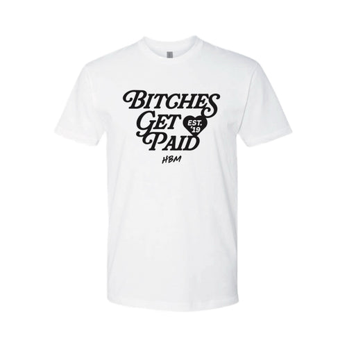 A white short-sleeve crewneck t-shirt with a black graphic print on the front reading 'BITCHES GET PAID' in a stylized font, with a small heart containing 'EST. 19' and 'HBM' underneath