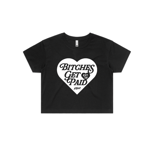 black crop top t-shirt with white heart with black text in it saying 'BITCHES GET PAID' on a white background