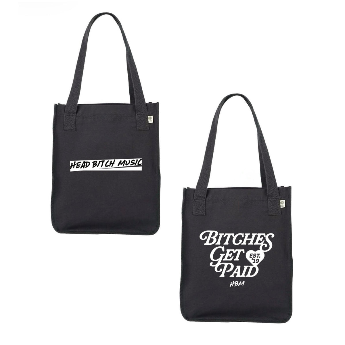 Two black canvas tote bags shown on a plain white background showing the front and back sides of the tote bag, each with white printed text. The left bag reads 'HEAD BITCH MUSIC' and the right bag reads 'BITCHES GET A PAID' both in white text.